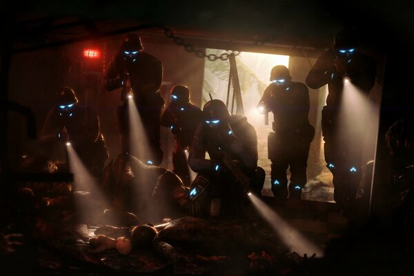 Special forces with lanterns in a dark room