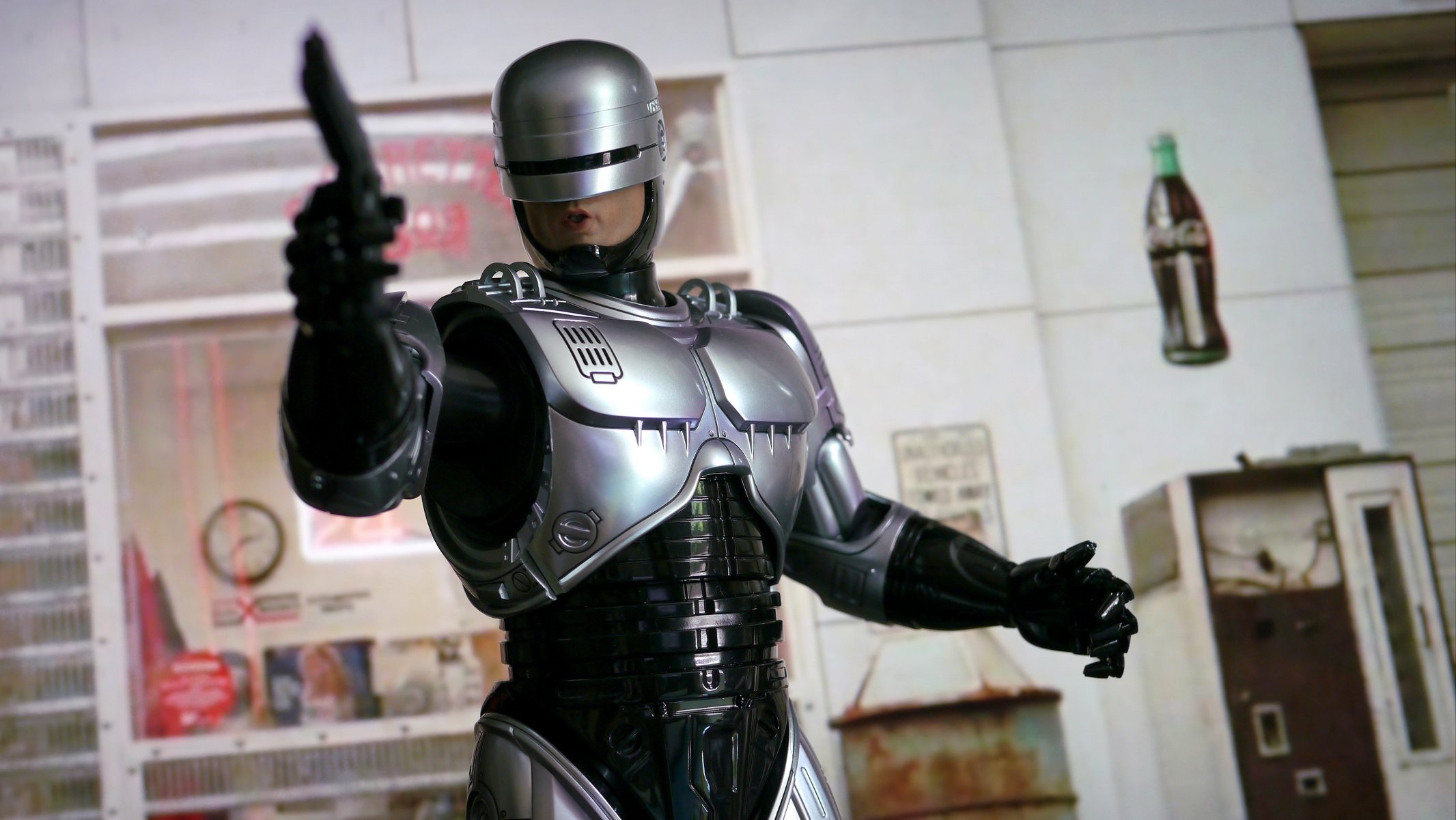 robocop robot cyborg zbroja pistolet broń tło