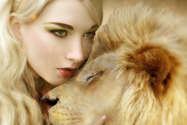 Beautiful girl cuddles with a lion