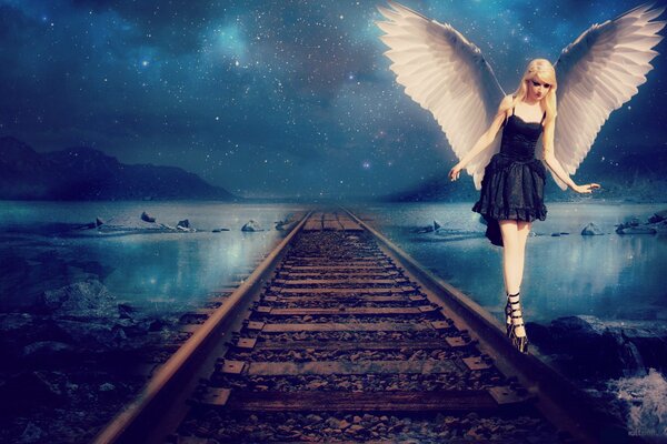 Chica de fantasía con alas caminando sobre rieles