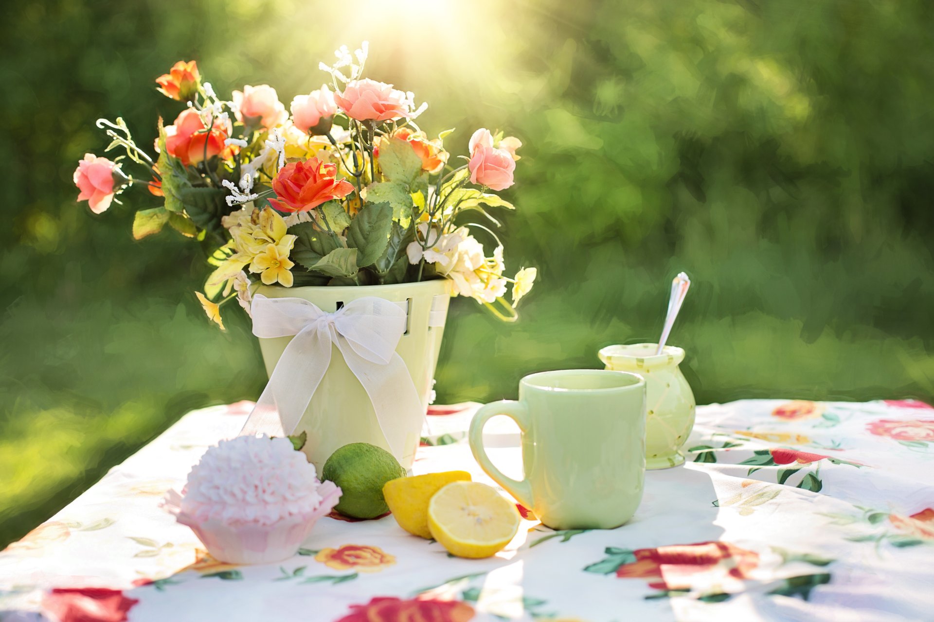 table tablecloth vase flower cup lemons cake