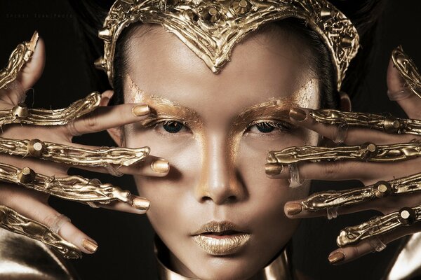 Girl with golden makeup and jewelry