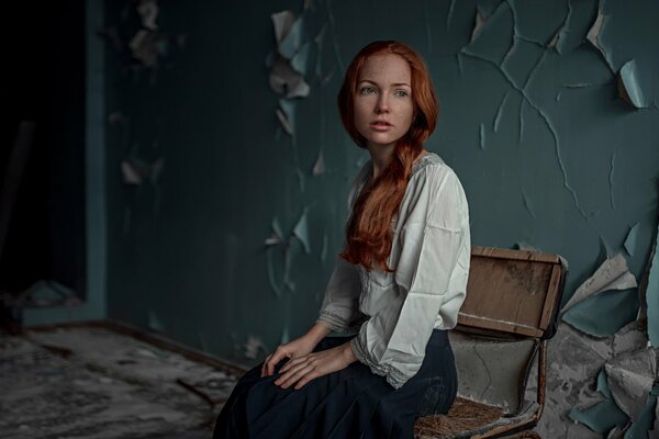 Thoughtful red-haired girl with freckles