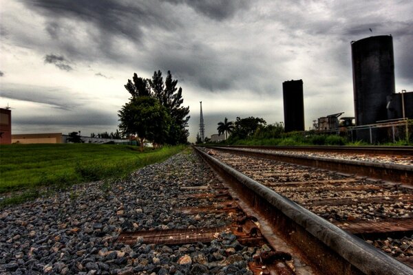 The path along the rails in a thunderstorm