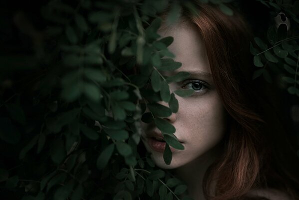 Beautiful photo portrait of a girl with leaves