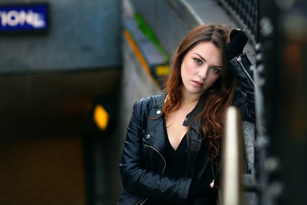 A girl in a black leather jacket