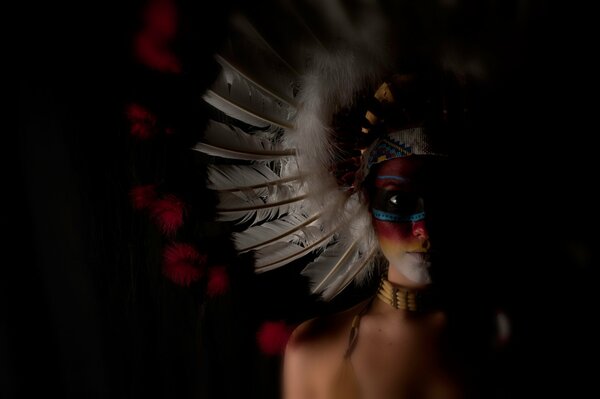 Painted face feather headdress