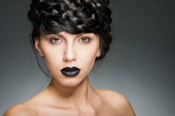 A girl with black lips and hair