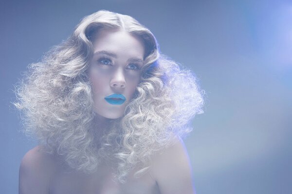 Blonde girl with curls and blue lipstick