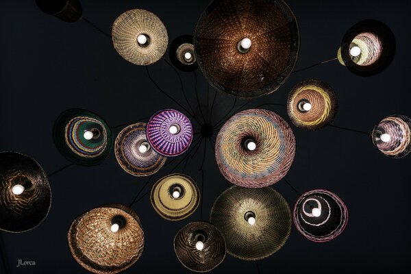 Multicolored lamps with lights on on a black background