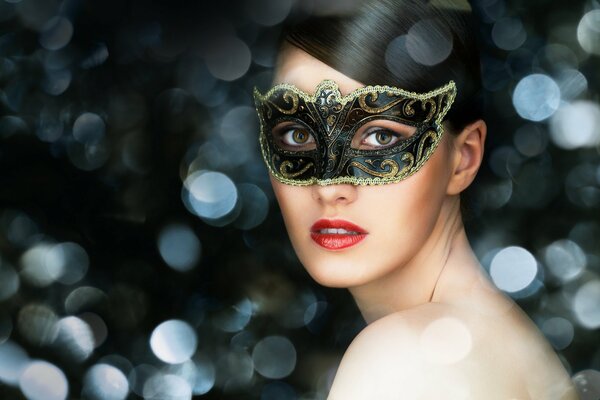 Beautiful brunette in a carnival mask