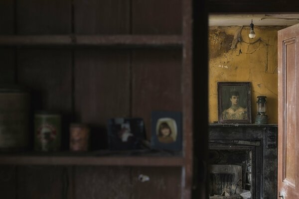 A room with antique paintings and portraits