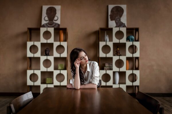 Thoughtful girl at the table