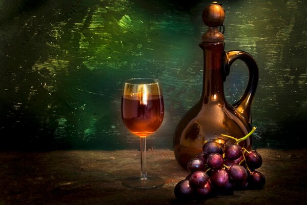Martwa natura przedstawiająca dzban i obok kieliszek wina, obok pędzel czerwonych winogron
