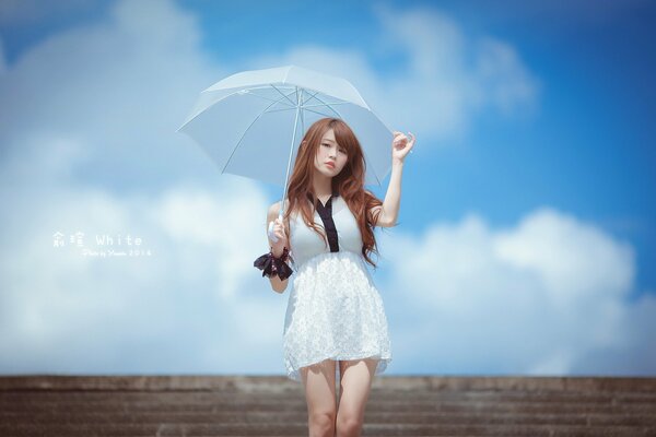 Asian girl under an umbrella