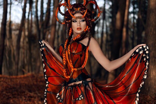 Photo of a girl in a latex butterfly outfit
