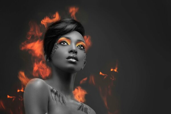 Retrato de una niña con sombras brillantes en llamas