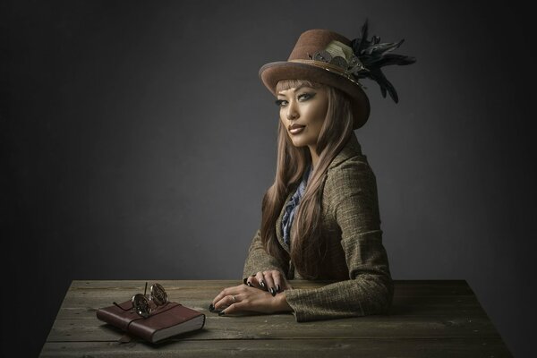 Fille au chapeau dans le style steampunk