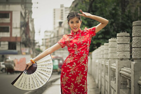 On a crowded street, a girl in the style of a Japanese woman