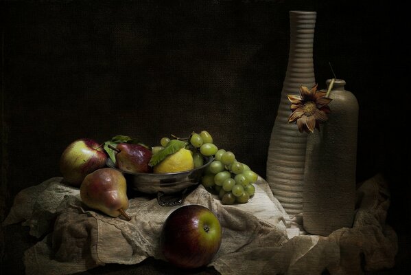 Vintage still life. Vase, bowl with fruit