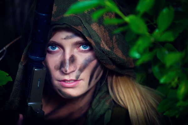 Girl with war paint and weapons