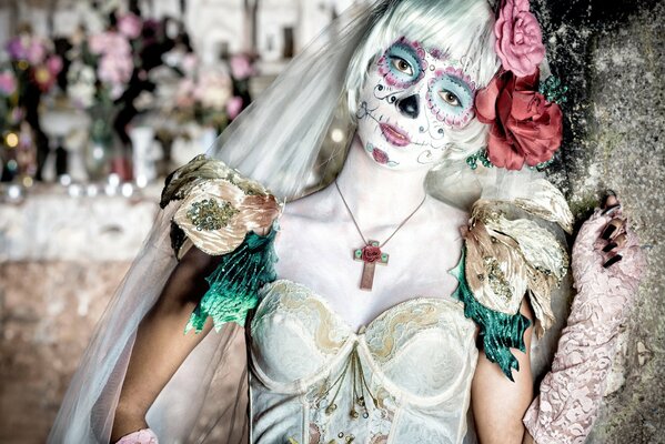 The girl with the painted face on the Day of the Dead