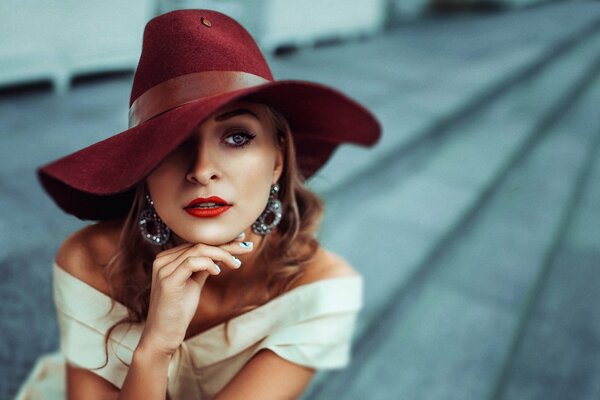 Beautiful girl in a big hat