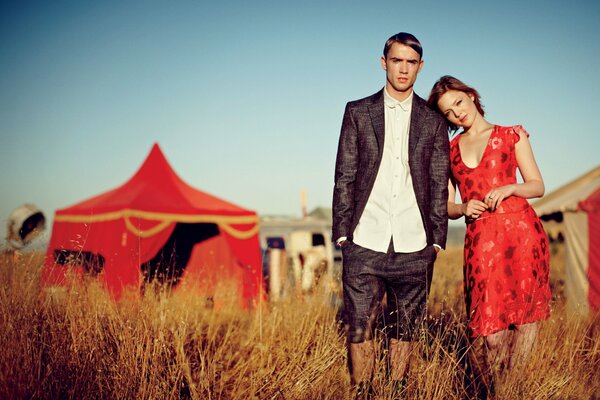 Couple posing against the background of the circus dome