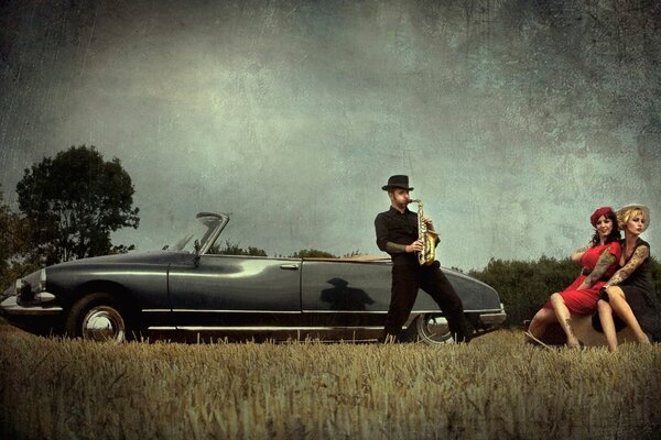 A man plays a saxophone for ladies in a black convertible