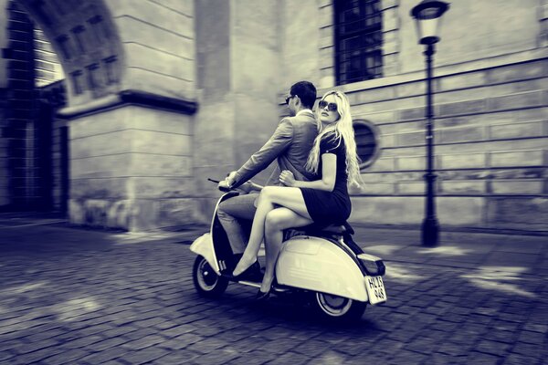 Guy with a girl on a motorcycle