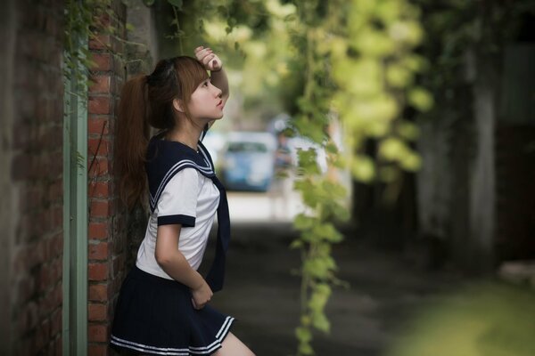 Stylish girl in a mini skirt on the street