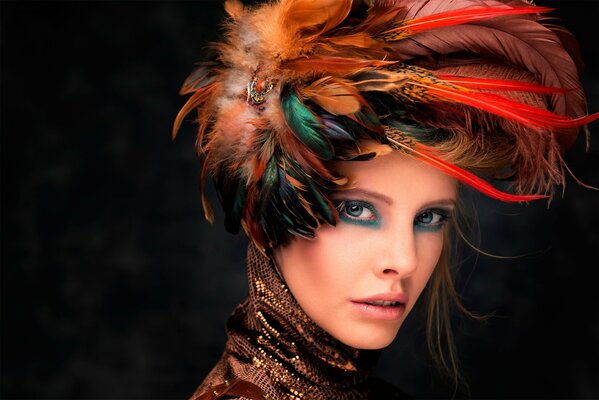 A girl with makeup with a hat with feathers