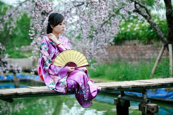 A stylish Asian girl in the middle of summer