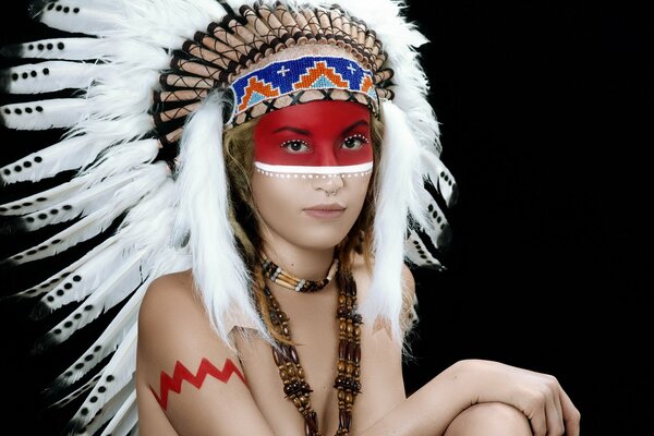 The girl in the outfit of Indian tribes