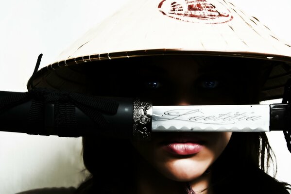 A girl in a headdress and with a katana