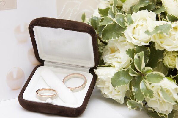 Wedding rings and delicate roses