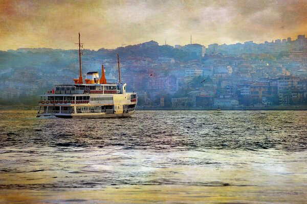 A ship on the river against the background of the city