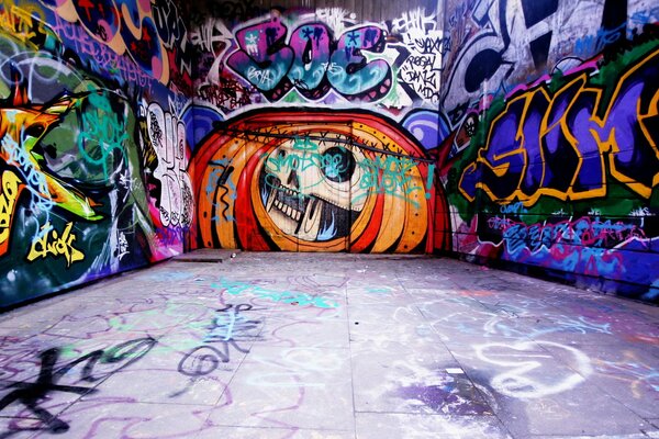 Graffiti with a skull in a pumpkin on a folet background