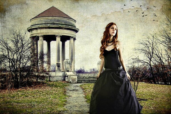A girl in Gothic style on the background of a gazebo