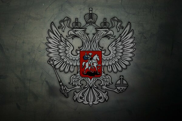 Coat of arms of the two-headed eagle of Russia on a gray background