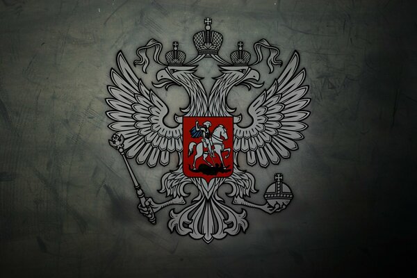 Escudo de armas del águila de dos cabezas de Rusia sobre un fondo gris