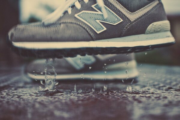Stylish sneakers in rainy weather