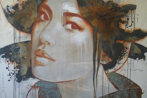 Graffiti of a girl s face on a gray background