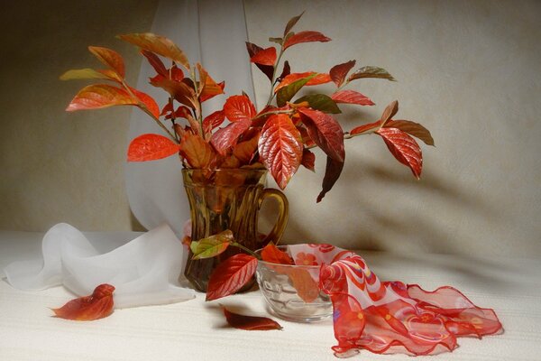 Still life vase with leaves. In autumn