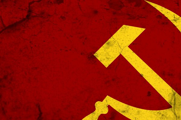 Yellow hammer and sickle on a red background