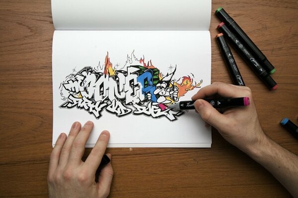 Colored graffiti is drawn with markers