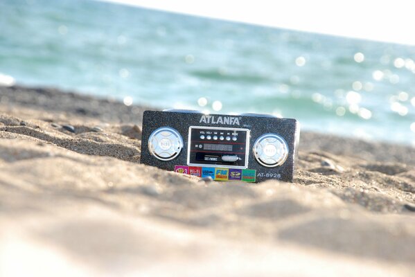 Radio in the sand on the seashore