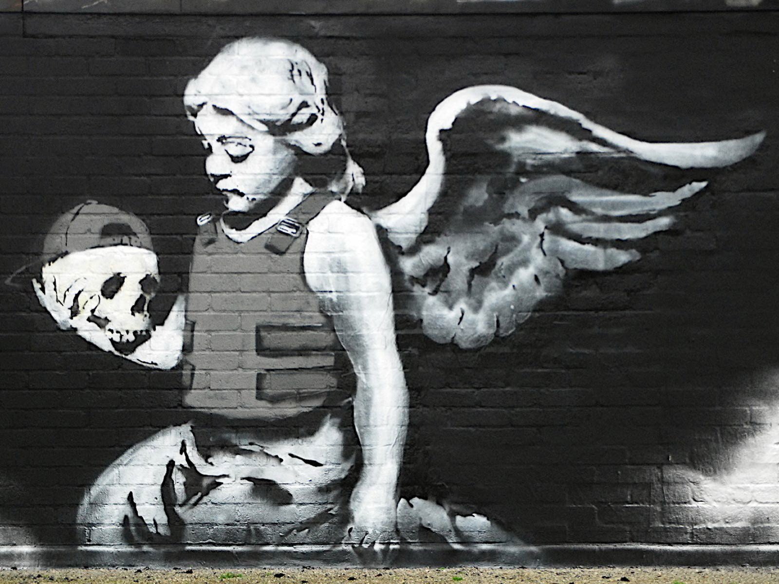 graffiti banksy cráneo ángel