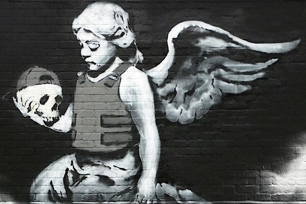 Grafito de ángel con cráneo
