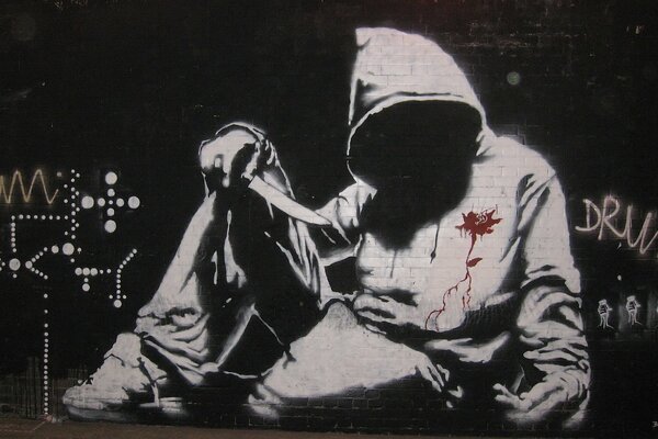 Sudadera Banksy en graffiti callejero